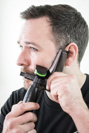 beard shaping tool man using it