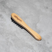 milkman moustache brush diagonal view showing etched branding and bristles