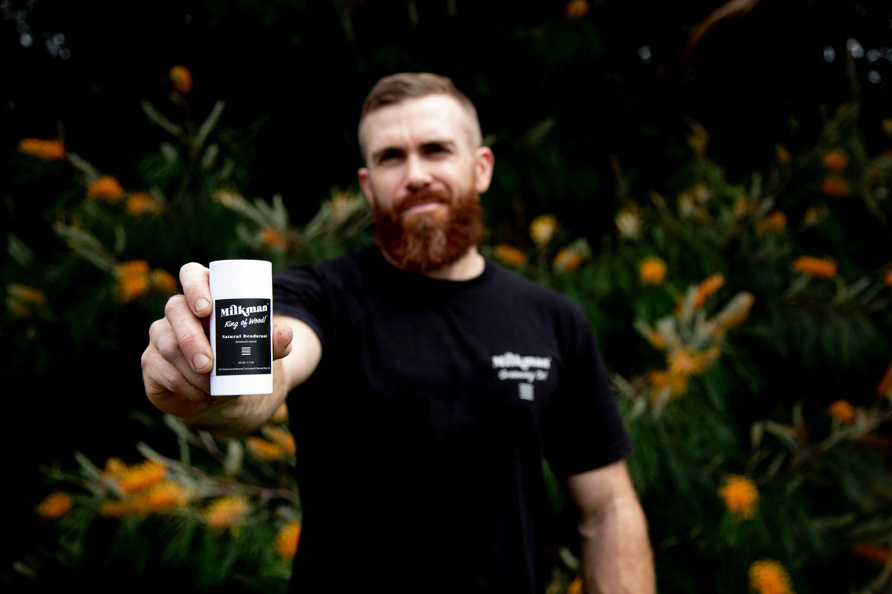 natural deodorant king of wood scent man holding